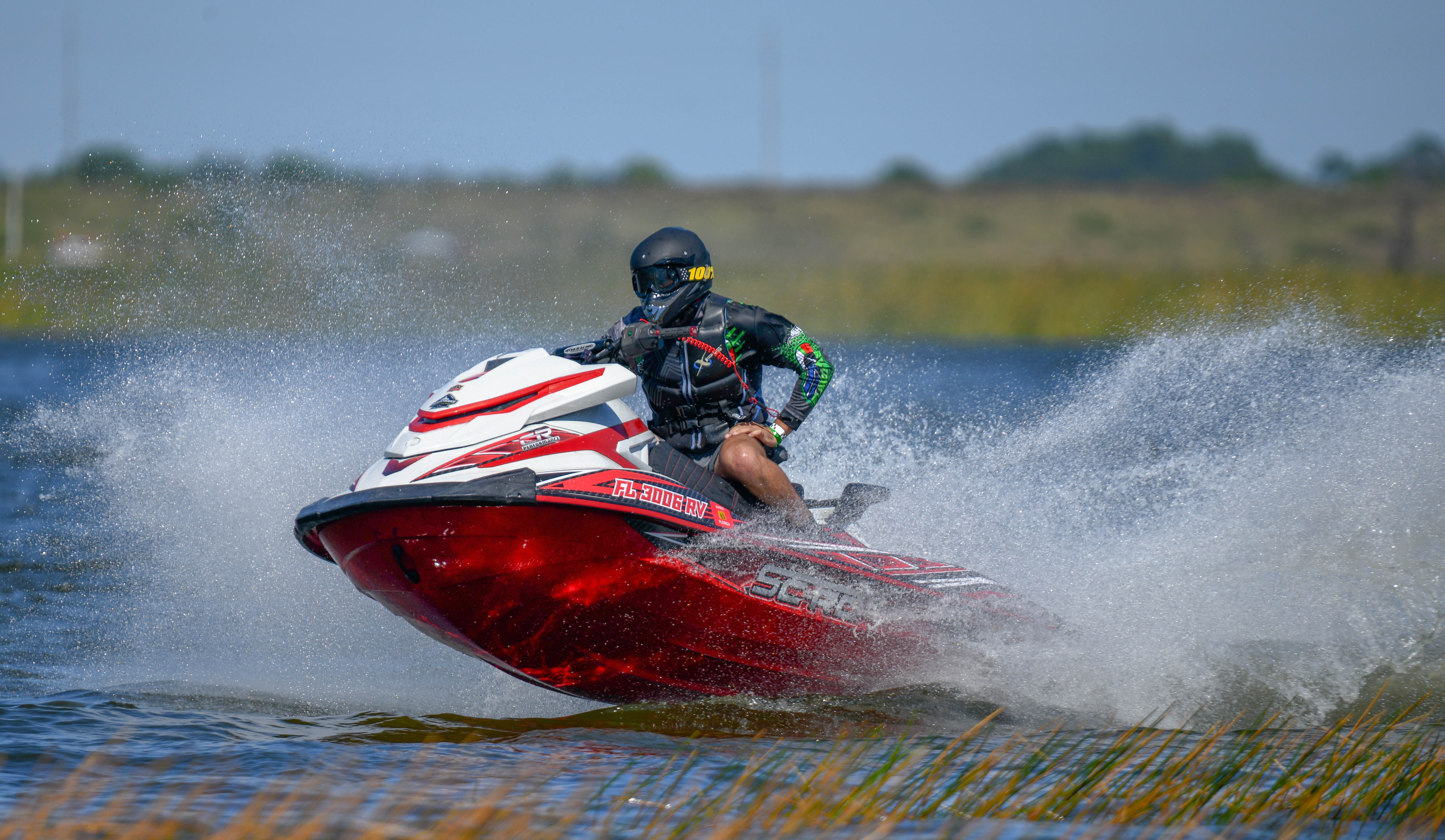 Man On Jet Ski With Safety Helmet